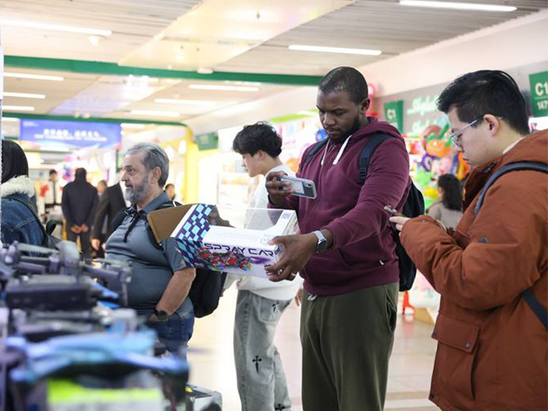 American tourists flock to China for luxury shopping and affordable vacations due to rising U.S. tariffs.